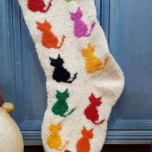 Multicolored cats on Christmas stocking