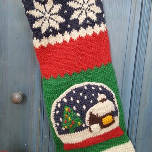 Custom embroidered name on red raw makes this Christmas stocking with snowball unique.