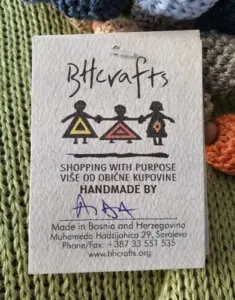 Handmade tag with artisan's name, highlighting the unique craftsmanship behind the product.