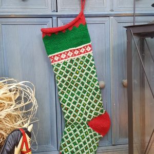 Green and red hand knit personalized holiday stockings with diamond lattice and scalloped cuff, artisan made.