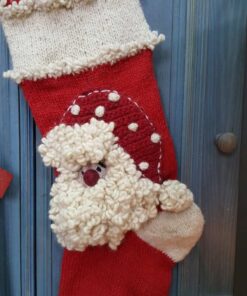 Detailed view of fluffy Santa Claus design on red and cream knit Personalized Christmas stocking.