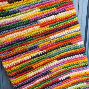 Close-up of crochet stitches on fair trade personalized Christmas stocking