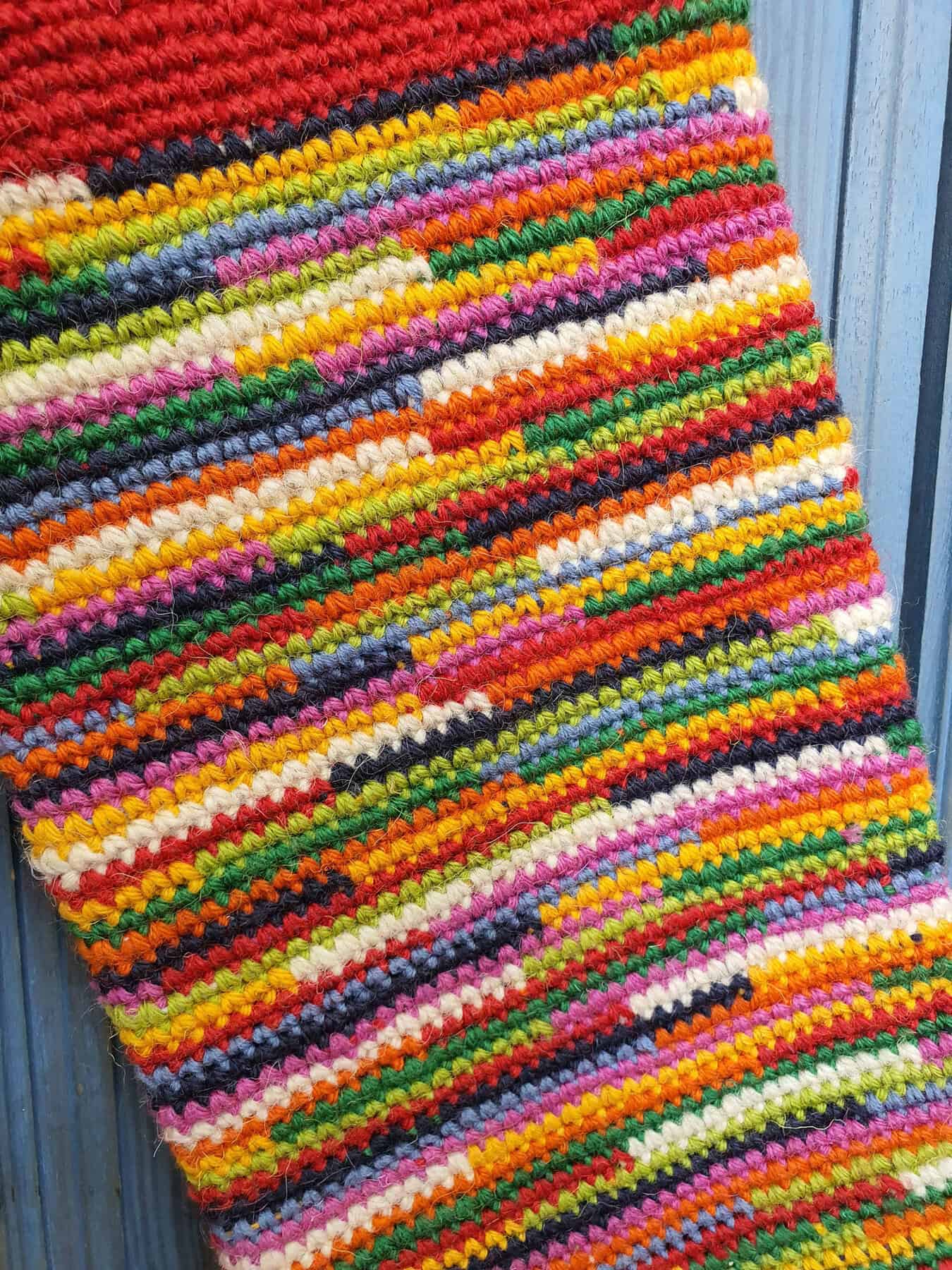 Close-up of crochet stitches on fair trade personalized Christmas stocking