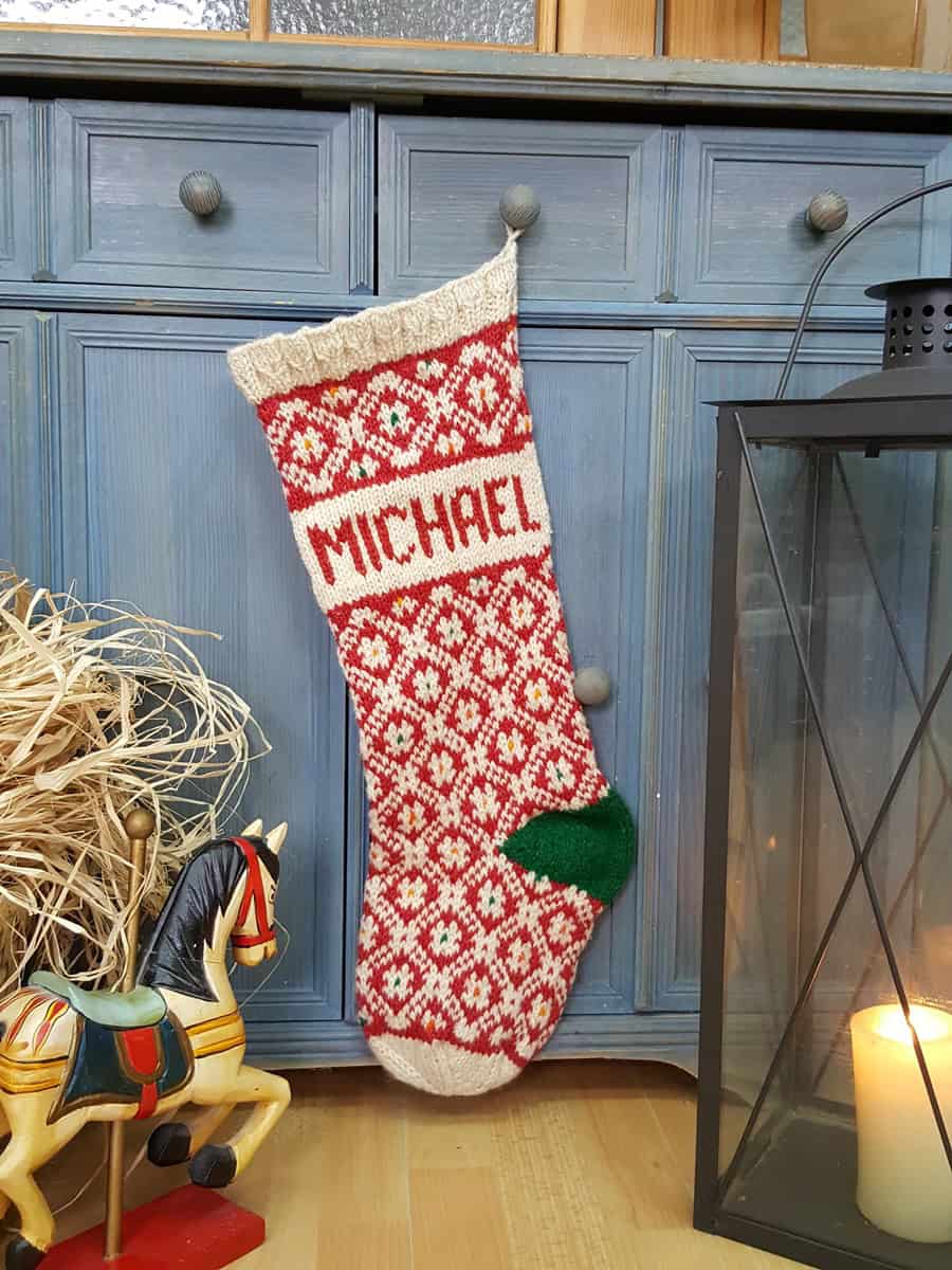 Close-up of custom name embroidery on Christmas stocking cuff