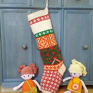 Hand-knitted festive tree stocking with bold multicolor jacquard patterns and space for name.