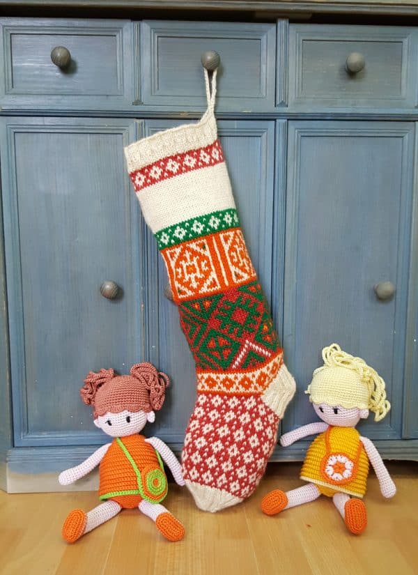 Hand-knitted festive tree stocking with bold multicolor jacquard patterns and space for name.