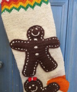 Close-up of gingerbread man appliqué on hand-knit stocking