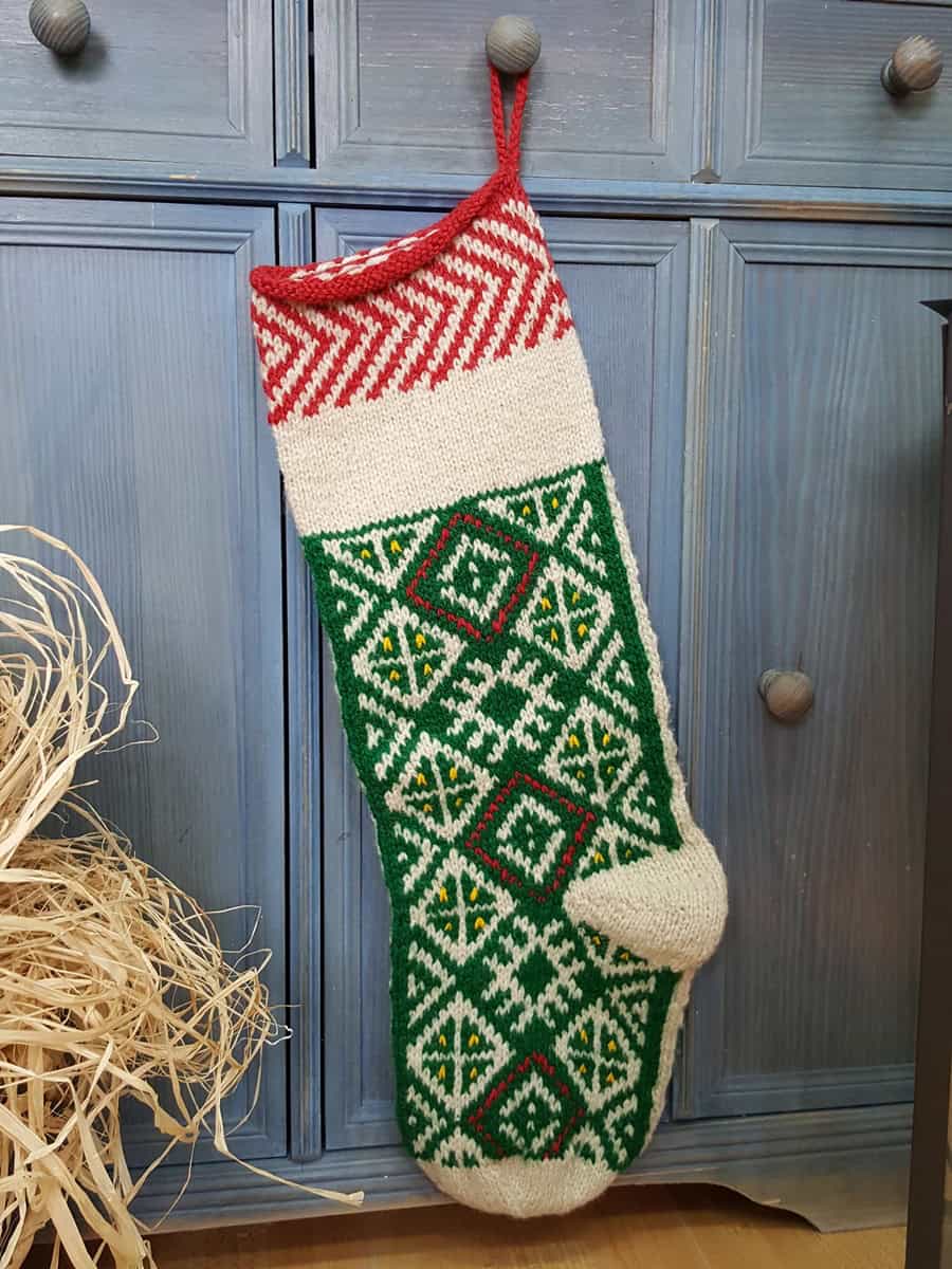 Traditional pattern on green Christmas tree stocking for your holiday home decor