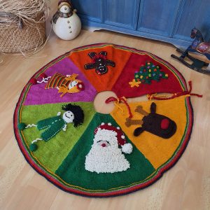 Hand-knit Fair Trade hand knit Christmas tree skirt with colorful circular stripes