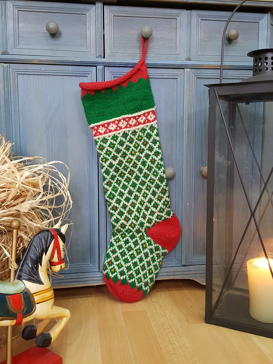 Green Christmas stocking with red cuff, heel, and toe; hand knit personalized holiday stockings