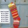 Colorful striped Christmas stocking with heart details, handmade