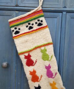 Black paw print crochet design at top of cat-themed Christmas stocking for your holiday décor