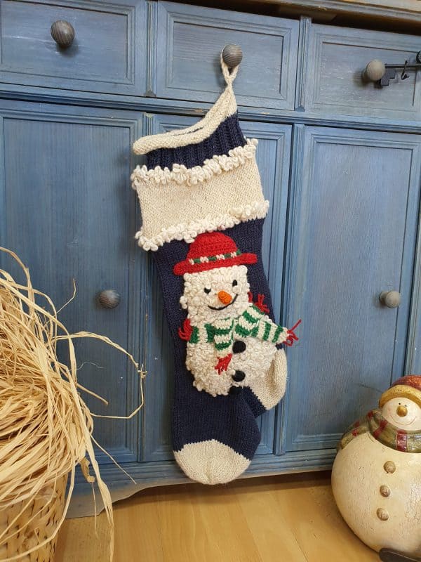 Hand-knit blue Christmas stocking with snowmen appliqué, personalized name on cuff