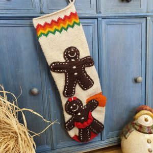 Hand-knit gingerbread man Christmas stocking with personalized name on cuff