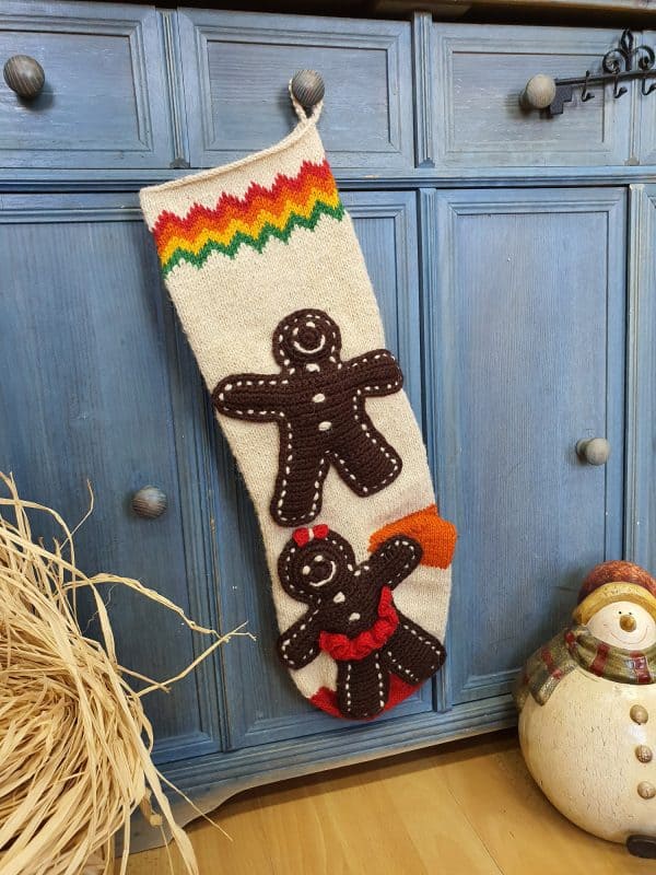 Hand-knit gingerbread man Christmas stocking with personalized name on cuff
