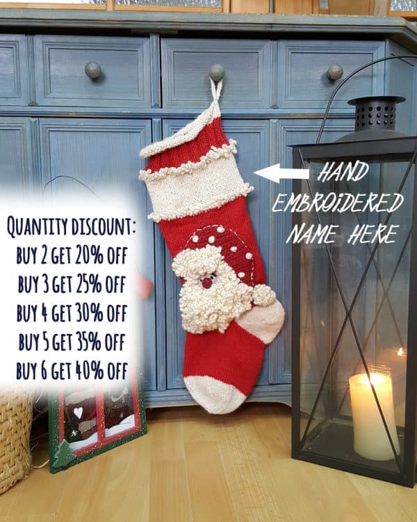 Personalized Christmas stocking with space for custom name, hand-knitted with Santa design.