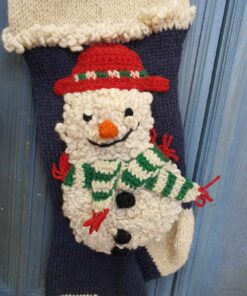 Close-up of snowman appliqué on hand-knit personalized Christmas stocking