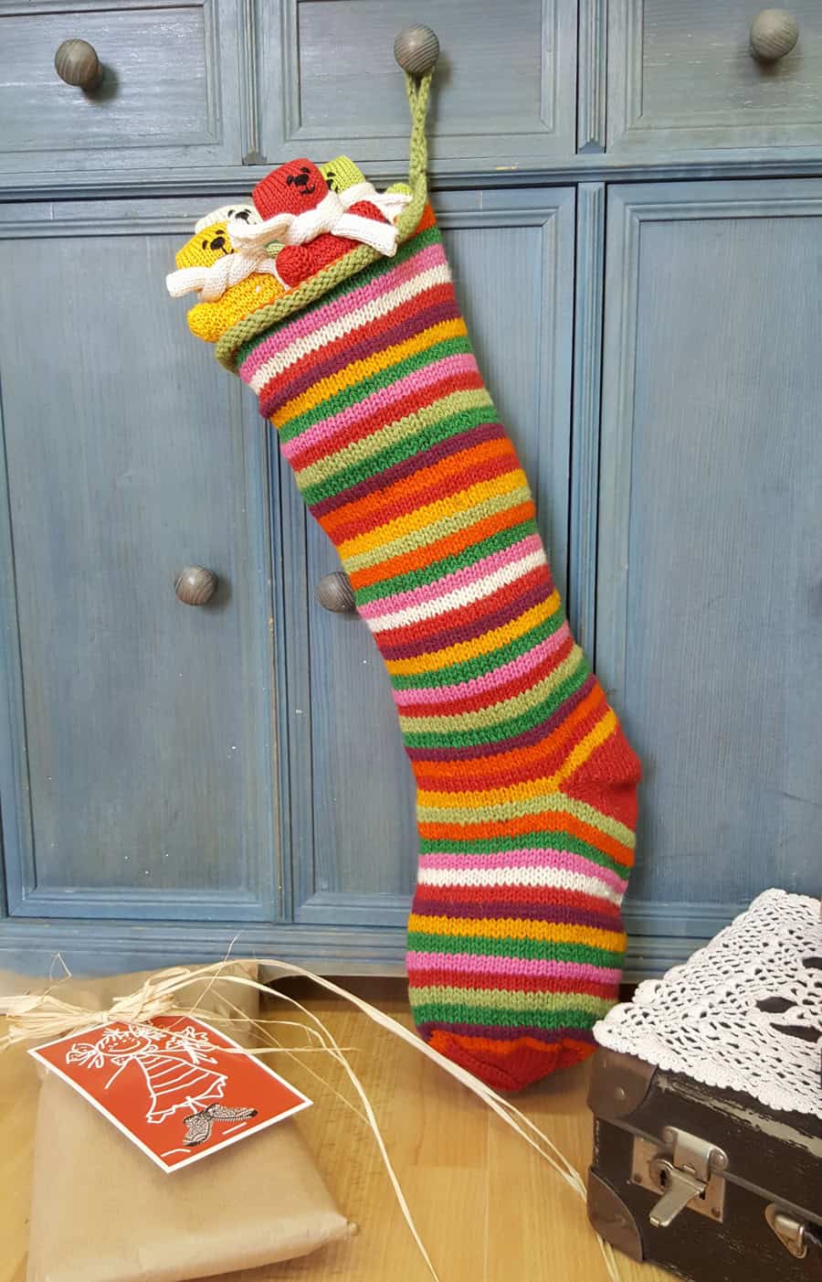 Multicolor striped holiday stocking, hand-knit in sustainable wool, 60×18 cm. Great addition to your Christmas home decor