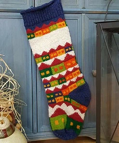 Holiday village motif on fair trade Christmas stocking which is eco-friendly made.