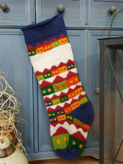 Holiday village motif on fair trade Christmas stocking which is eco-friendly made.