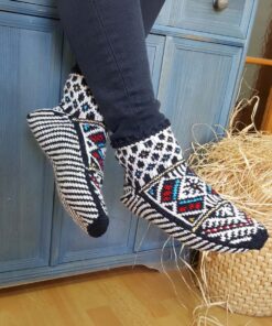 Hand knit wool slipper socks with traditional Bosnian pattern worn indoors