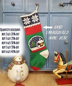 Hand-knit Christmas stocking with snowball applique.