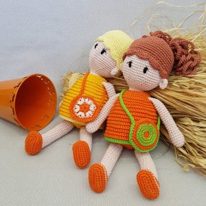 yellow and orange dolls
