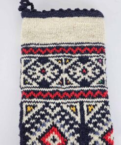 Close-up of top part of the navy Christmas stocking where free personalized embroidery can be placed.