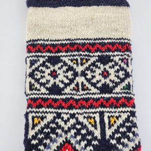 Close-up of top part of the navy Christmas stocking where free personalized embroidery can be placed.