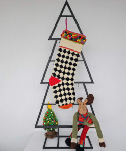 Fair-trade Christmas stocking featuring a classic houndstooth knit design with multicolored accent bobbles.