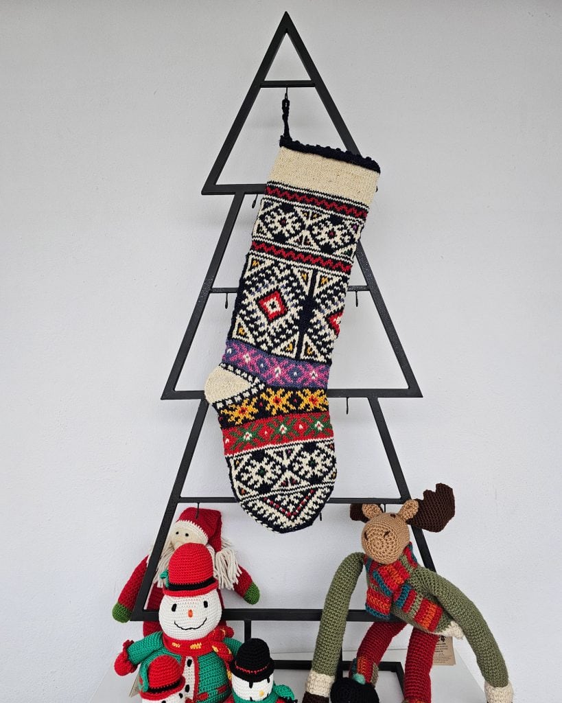 Personalized Christmas stocking hanging on Christmas tree shape in sophisticated navy design for your holiday decor