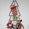 Traditional Holiday stocking hanging on Christmas tree shape