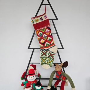 Traditional Holiday stocking hanging on Christmas tree shape