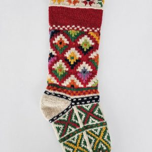 Hand-knitted traditional Christmas tree stocking with red-and-white pattern