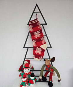 Red hand-knitted fair trade snowflake Christmas stocking hanging on Christmas tree shape