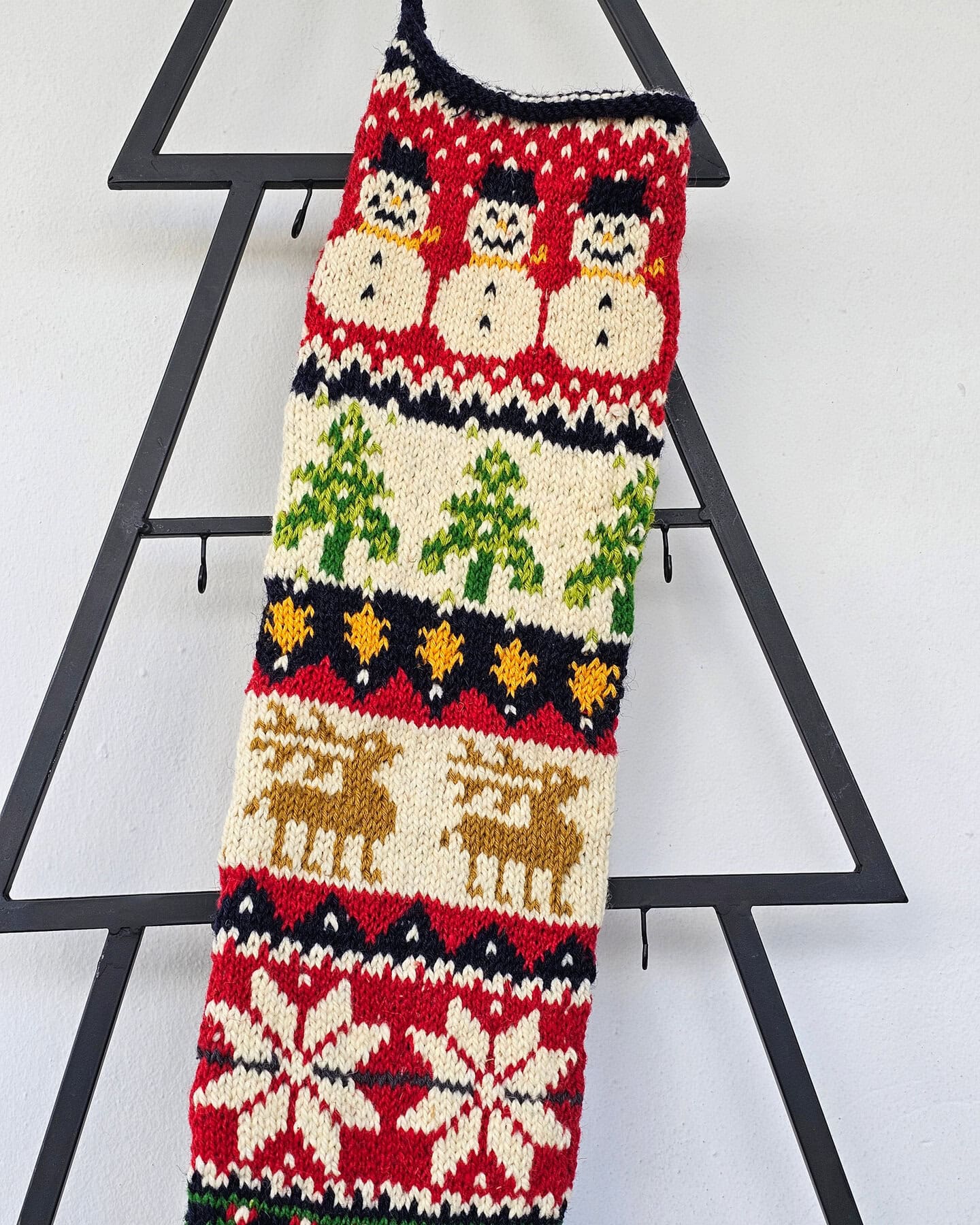 Top view of handmade Christmas stocking showing the opening and interior space for gifts.