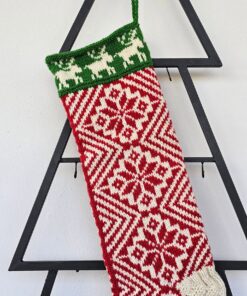 Close-up of the intricate geometric patterns on the handmade traditional Christmas stocking.