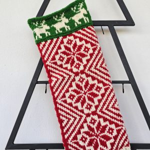 Close-up of the intricate geometric patterns on the handmade traditional Christmas stocking.