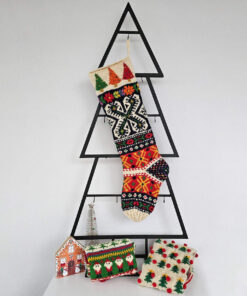Handmade Boho Style Christmas stocking displayed on a Christmas tree shape with holiday decorations and a cozy ambiance.