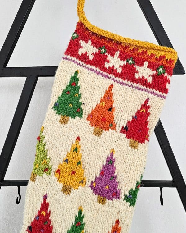 Christmas stocking displayed on a mantel with holiday decorations and a cozy ambiance.