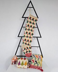Christmas stocking displayed on a Christmas tree shape with holiday decorations and a cozy ambiance.