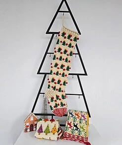 Christmas stocking displayed on a Christmas tree shape with holiday decorations and a cozy ambiance.
