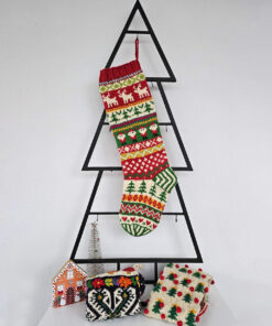 Christmas stocking displayed on a Christmas tree shape with holiday decorations.