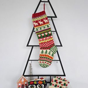 Christmas stocking displayed on a Christmas tree shape with holiday decorations.