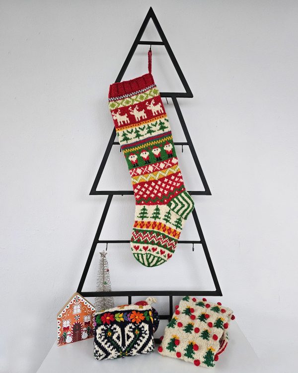 Christmas stocking displayed on a Christmas tree shape with holiday decorations.