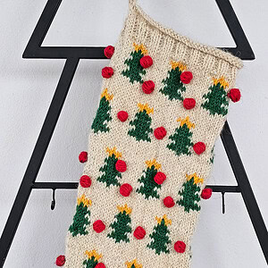 Top-down view of hand-knit Christmas stocking showing the opening for gifts and interior space.