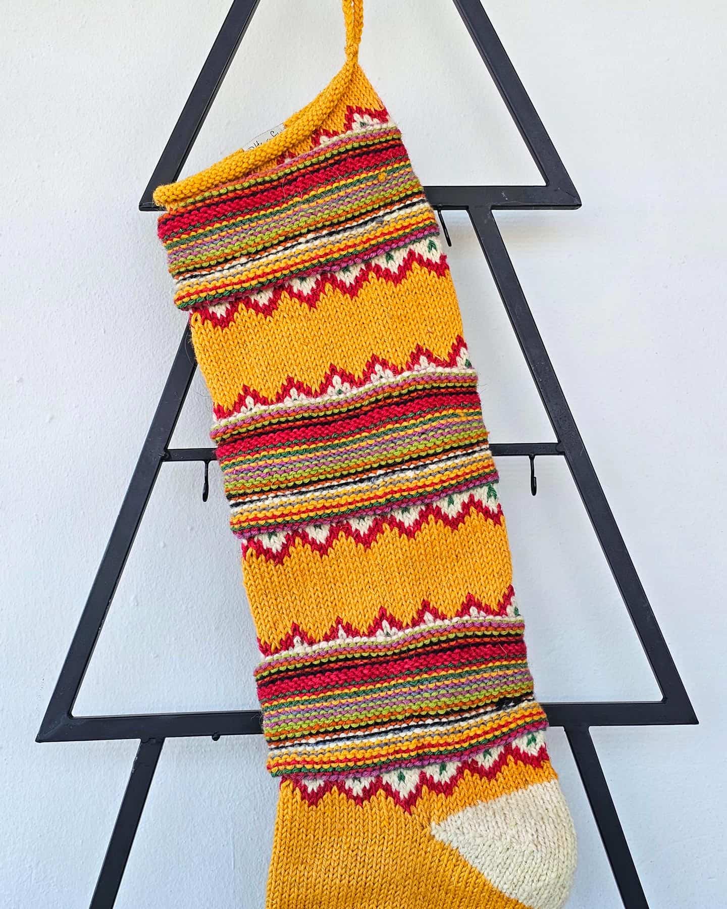 Close-up of chevron zigzag pattern on Christmas stocking, perfect for your holiday home decor