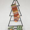 Handmade colorful Christmas stocking hanging on mantel