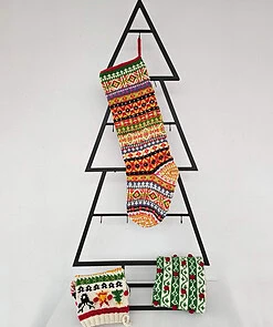Handmade colorful Christmas stocking hanging on mantel
