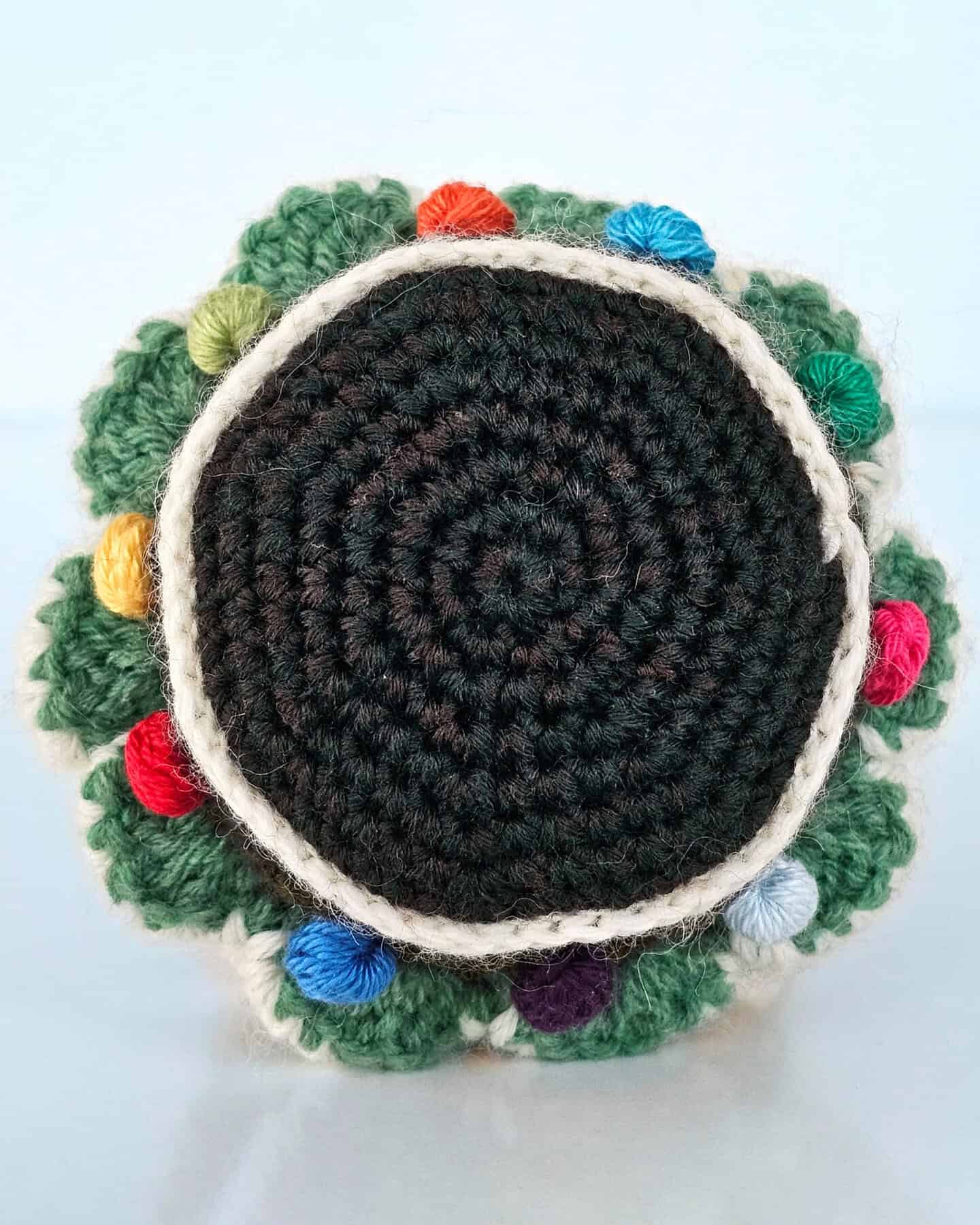 Close-up showing the crochet stitches and texture of the handmade Christmas tree christmas décor.